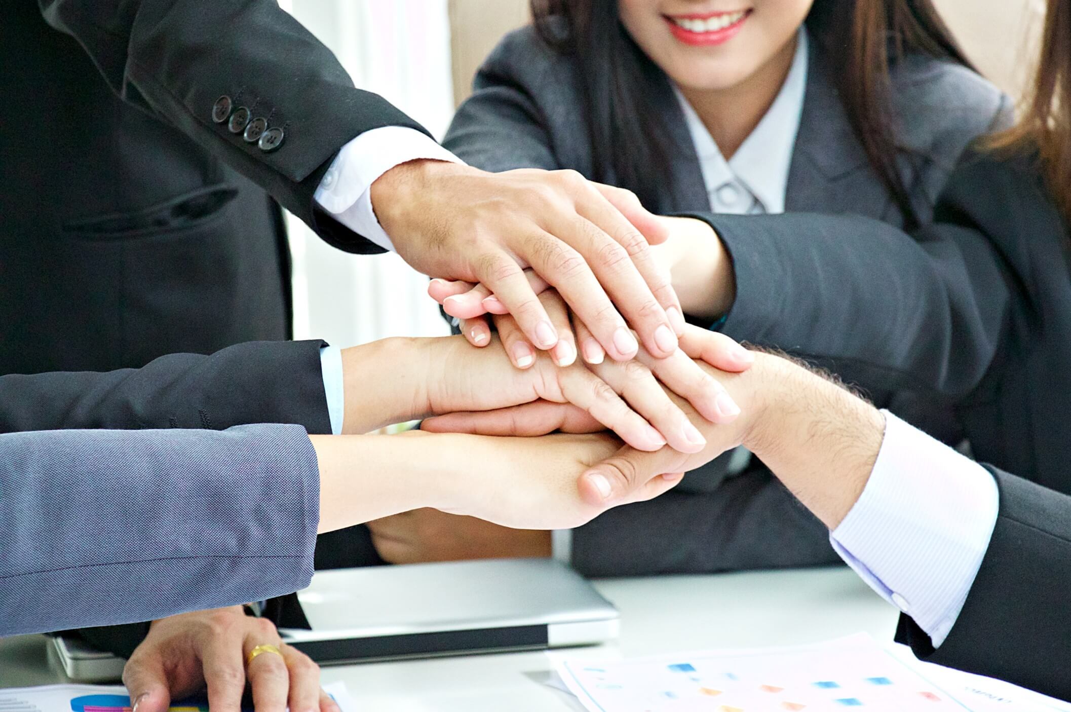 hand-of-teamwork-business-meeting-with-positive-result_t20_roYWVd.jpg
